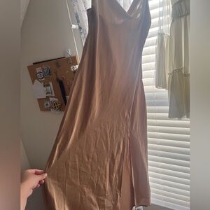 Shiny dress with slit